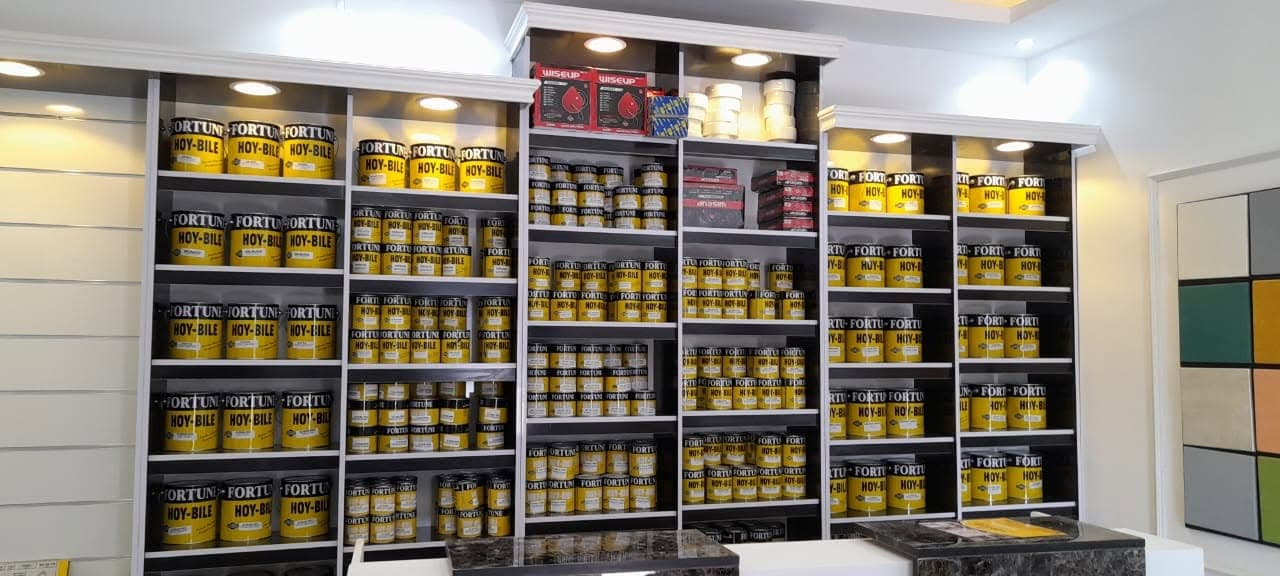 Fortune Paint Factory showroom with paint products displayed on shelves